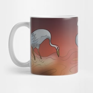 Japanese cranes in a stream at sunset Mug